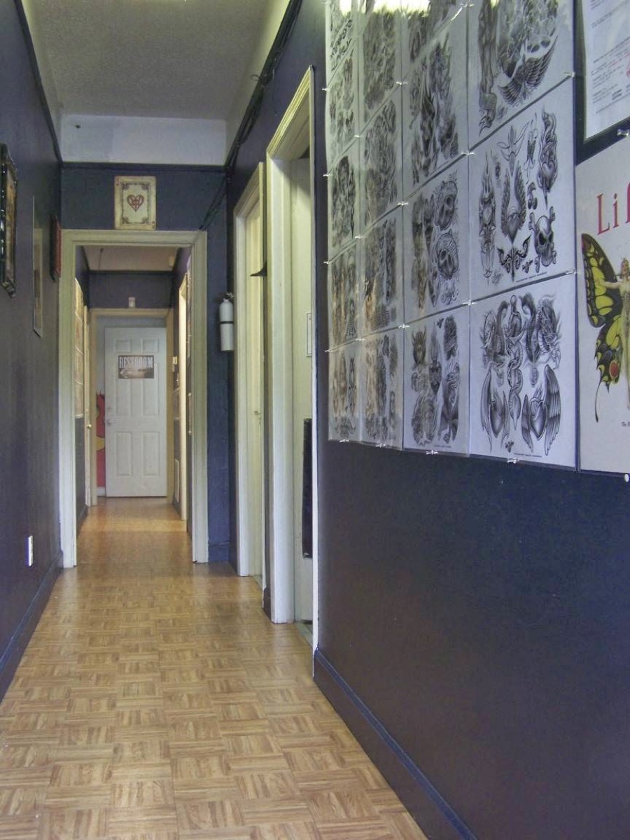 Flash art covering the walls of the Absolution Ink Tattoo studio
