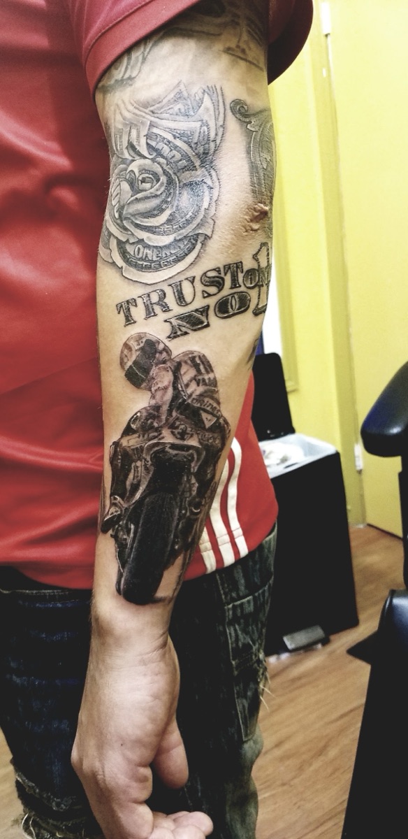 Black and grey forearm sleeve with motorcycle and Trust No 1 lettering